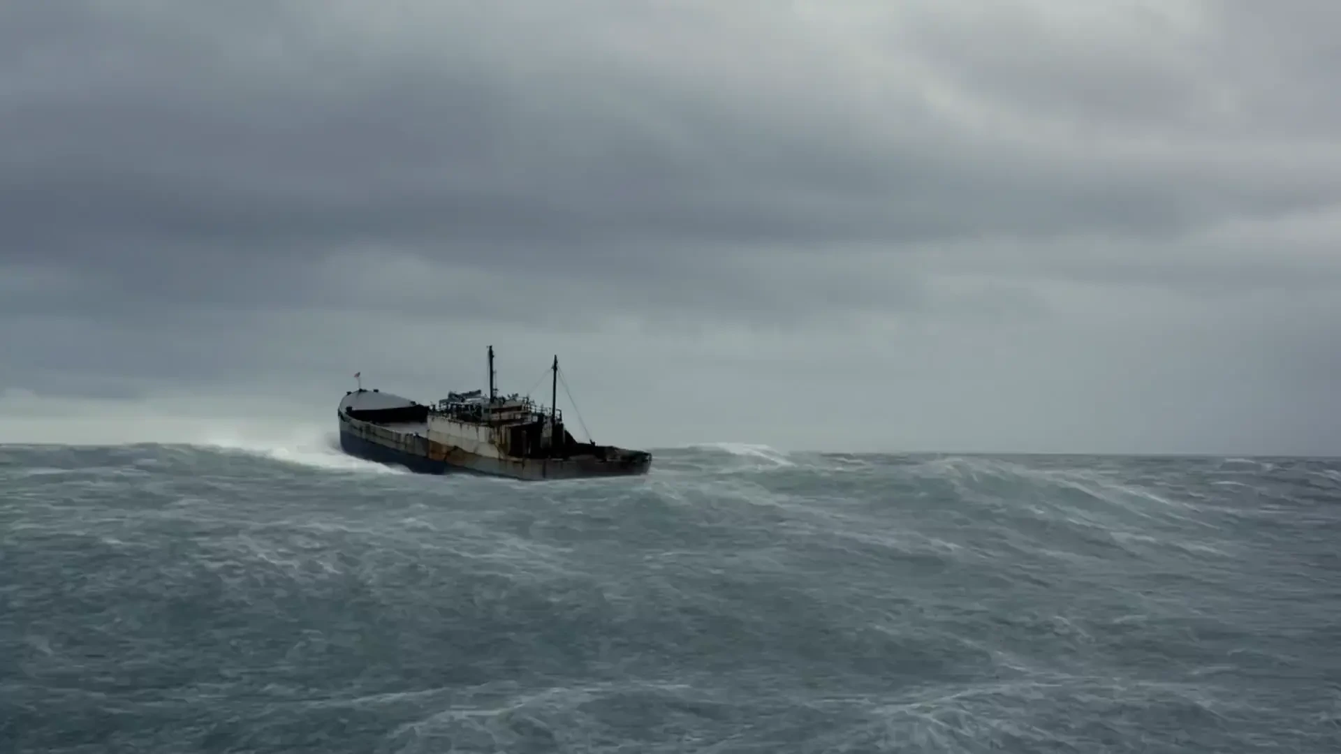 A giant ship sailed under a gloomy sky